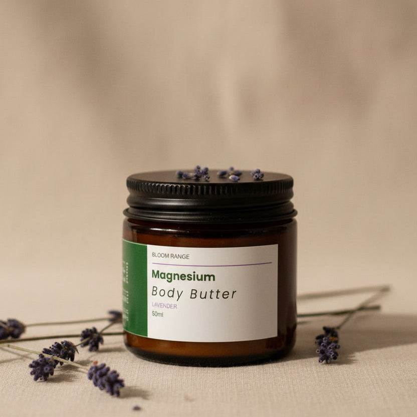 A dark amber jar of Audere Pure Magnesium Body Butter with a white and green label, styled with fresh lavender sprigs.